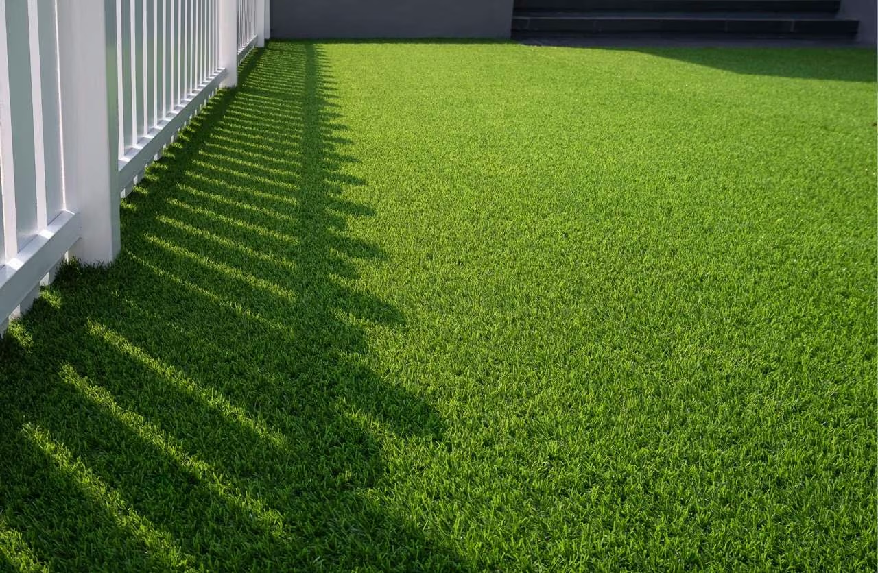 Artificial turf and a fence