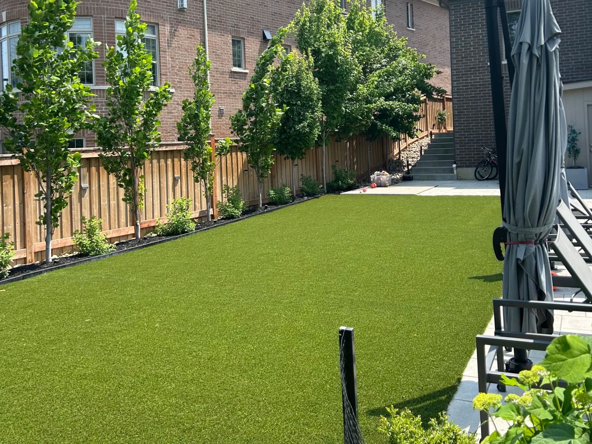Artificial turf installed around a pool