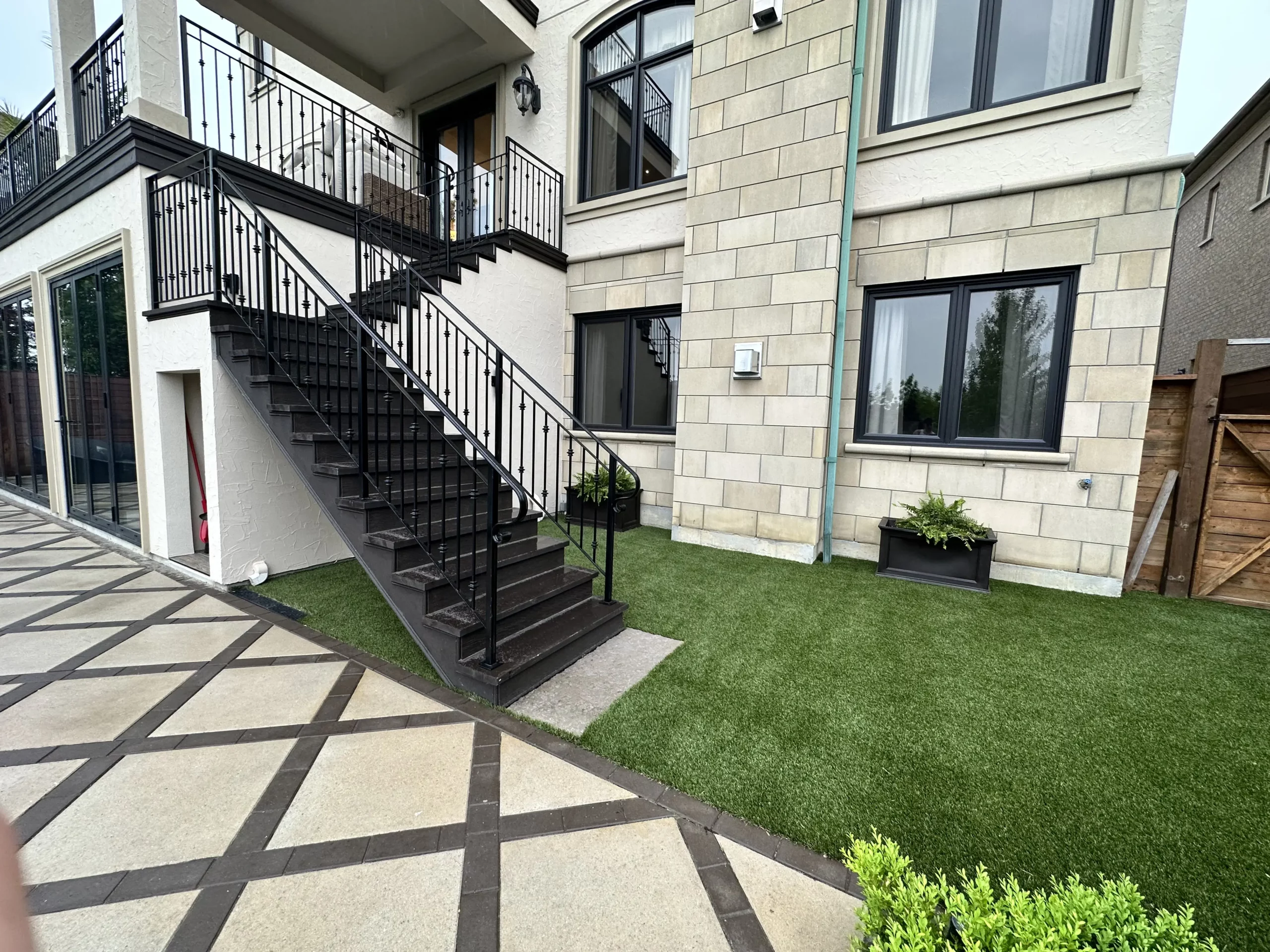 Fresh artificial grass lawn installation
