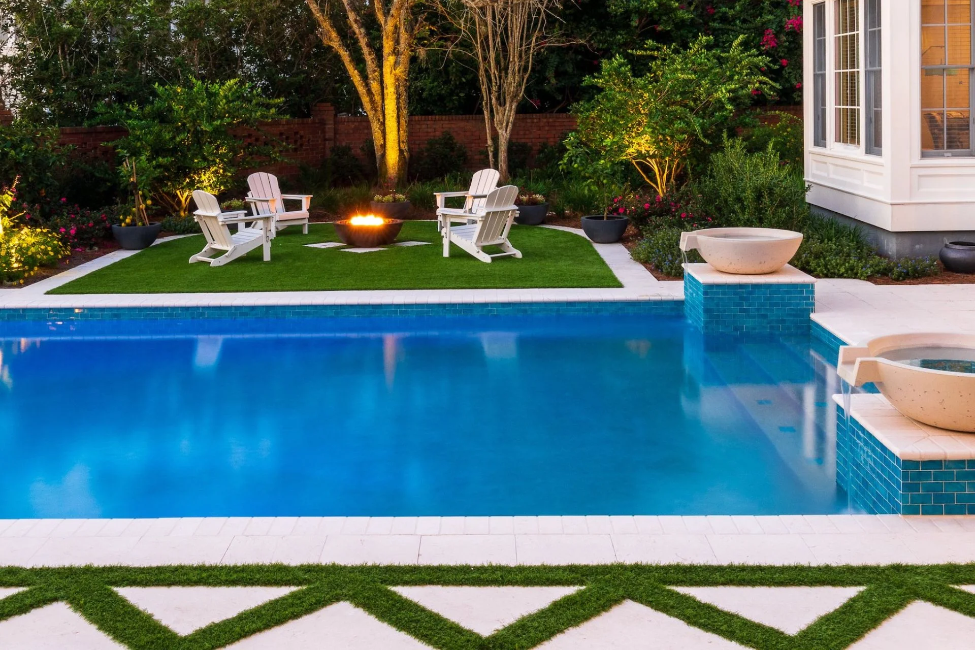 Swimming pool surrounded by artificial grass